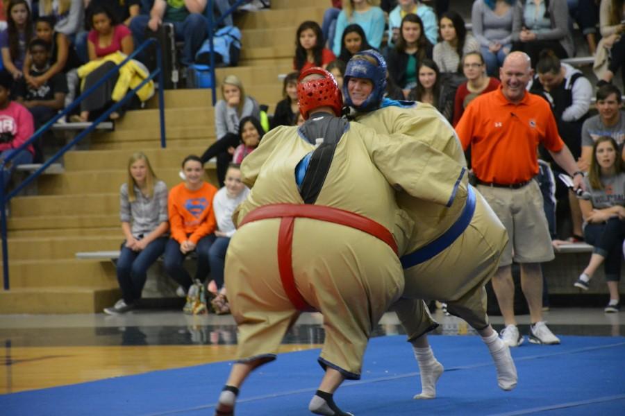 Science+teacher+Tina+Gragg+takes+on+English+teacher+Alex+Hollis+in+a+sumo+wrestling+Battle+of+the+Sexes+at+the+pep+rally+on+April+16.+