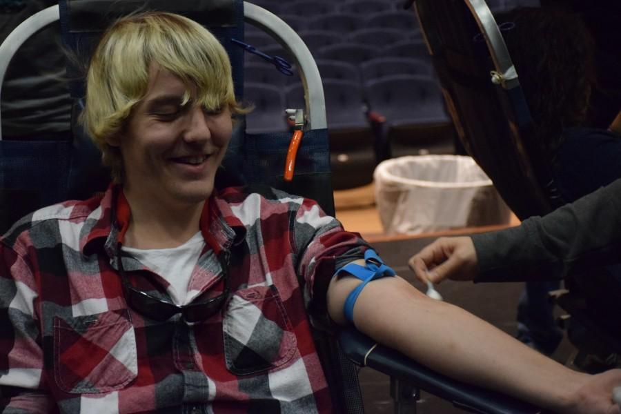 Senior Austin Johnson donates blood Friday. 