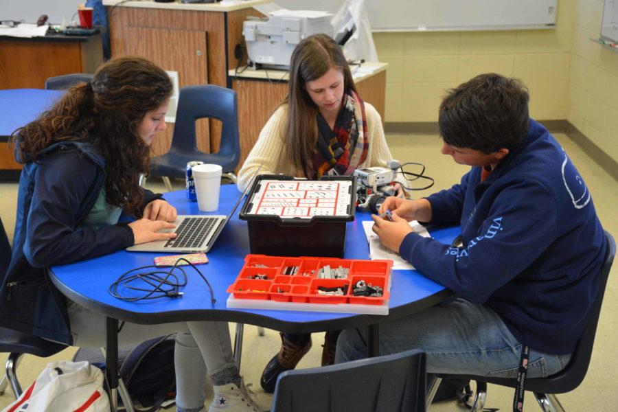 Sophomores Graci Moore, Carly Rae Blackston and Chandler Poteat work on Lego Robotics during physical science.