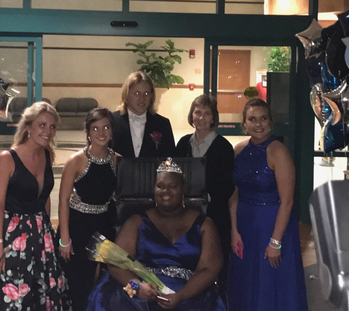 Members of Chapman's Spanish IV class, including teacher Sandra McClure (second from right), pose with 2017 prom queen MeKayla Gist. 