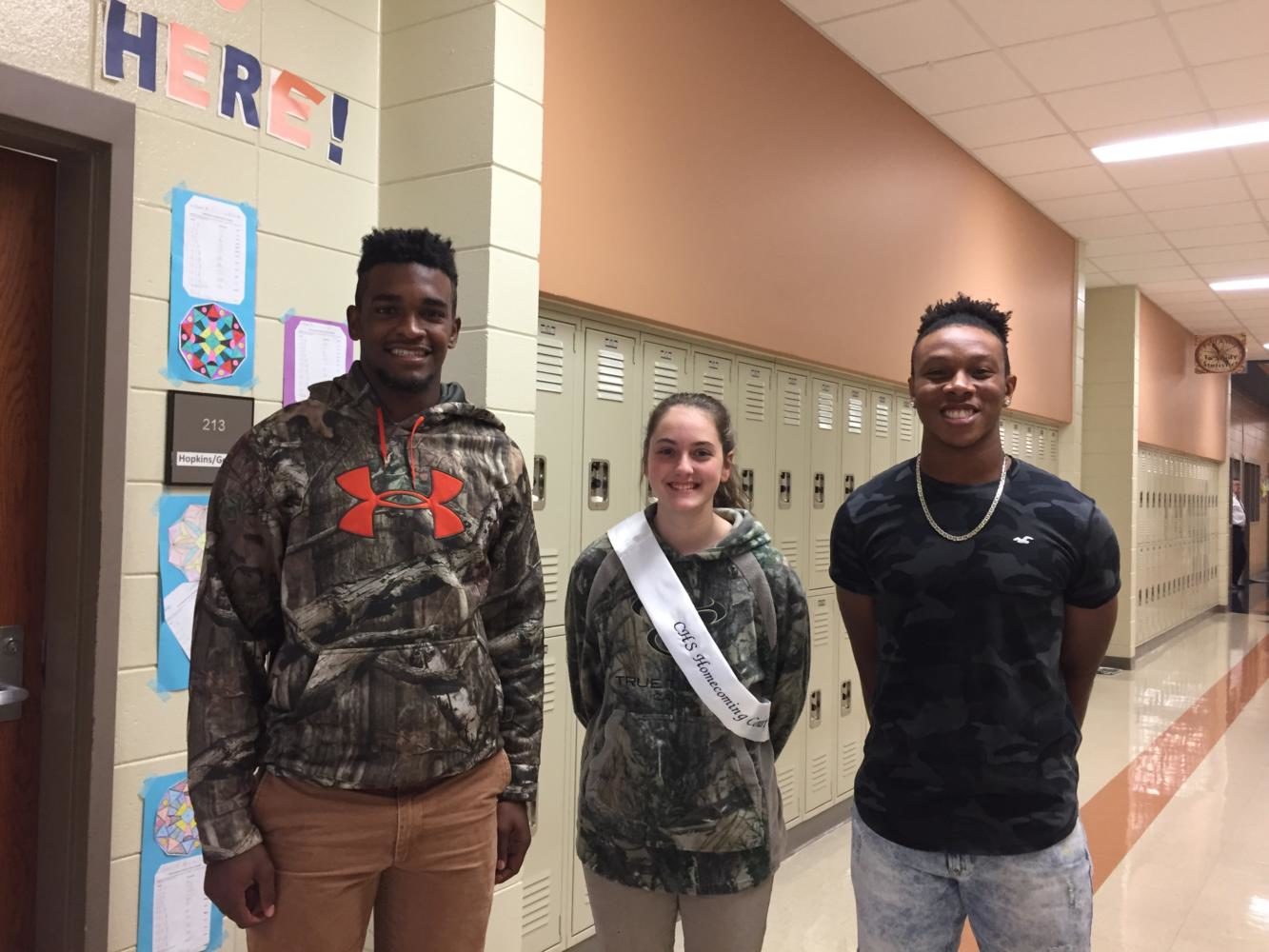 Seniors DJ Twitty, Graci Lovett and AJ Smith on Camo Day