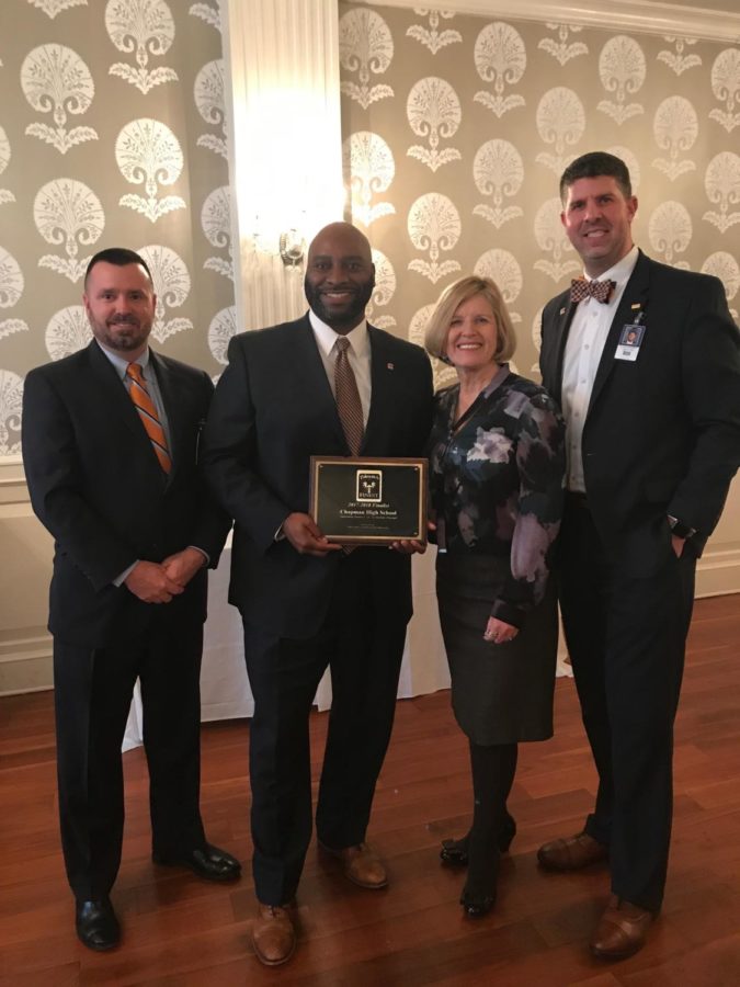 District 1 Superintendent Dr. Ron Garner, Chapman Principal Ty Dawkins and Assistant Principal Andrew McMillan receive plaque from South Carolina Superintendent of Education Molly Spearman at Palmetto Center in Columbia, SC on Monday morning.