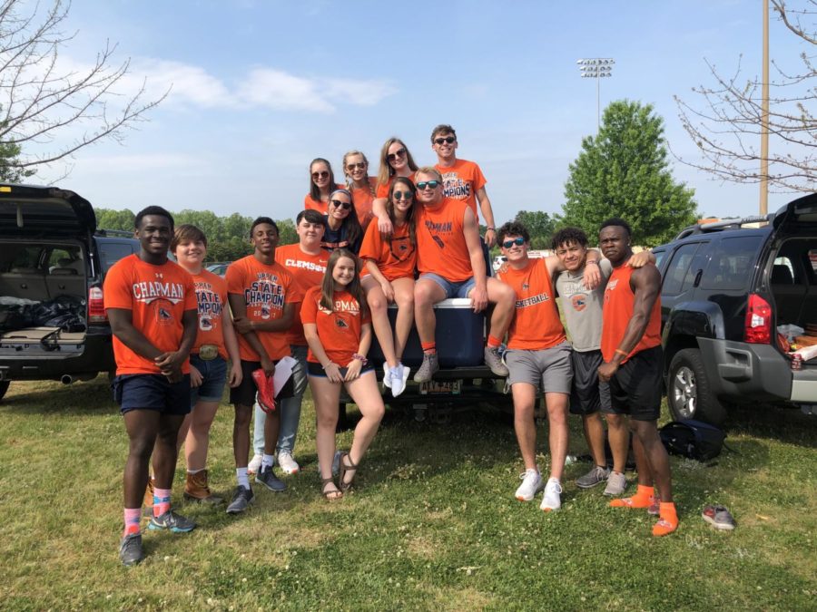 Chapman students decked out in orange at the pregame tailgate ready to cheer on the panthers in a game against Woodruff