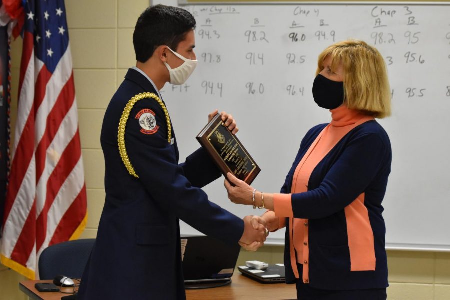 South Carolina Superintendent of Education Molly Spearman presents senior Chris Freire with an award for South Carolina Cadet of the Year. 
