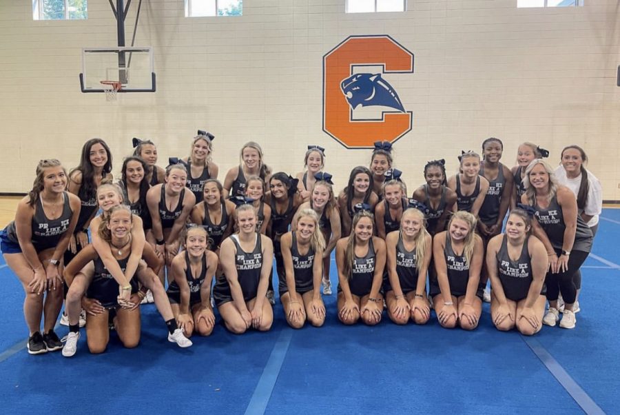 The Chapman High School varsity cheerleading team poses for a picture. The team is being led by new coach Allie Linnerud. 