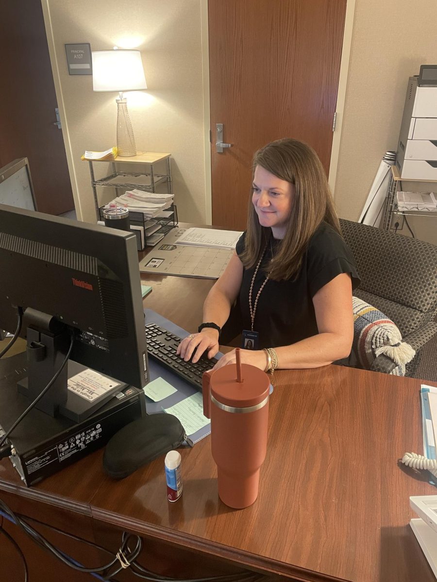 Attendance clerk Adrienne Miller works to process student tardies and absences. Miller, who joined the Chapman staff this year, said that school is actively assigning detention and ISS for tardies and absences.