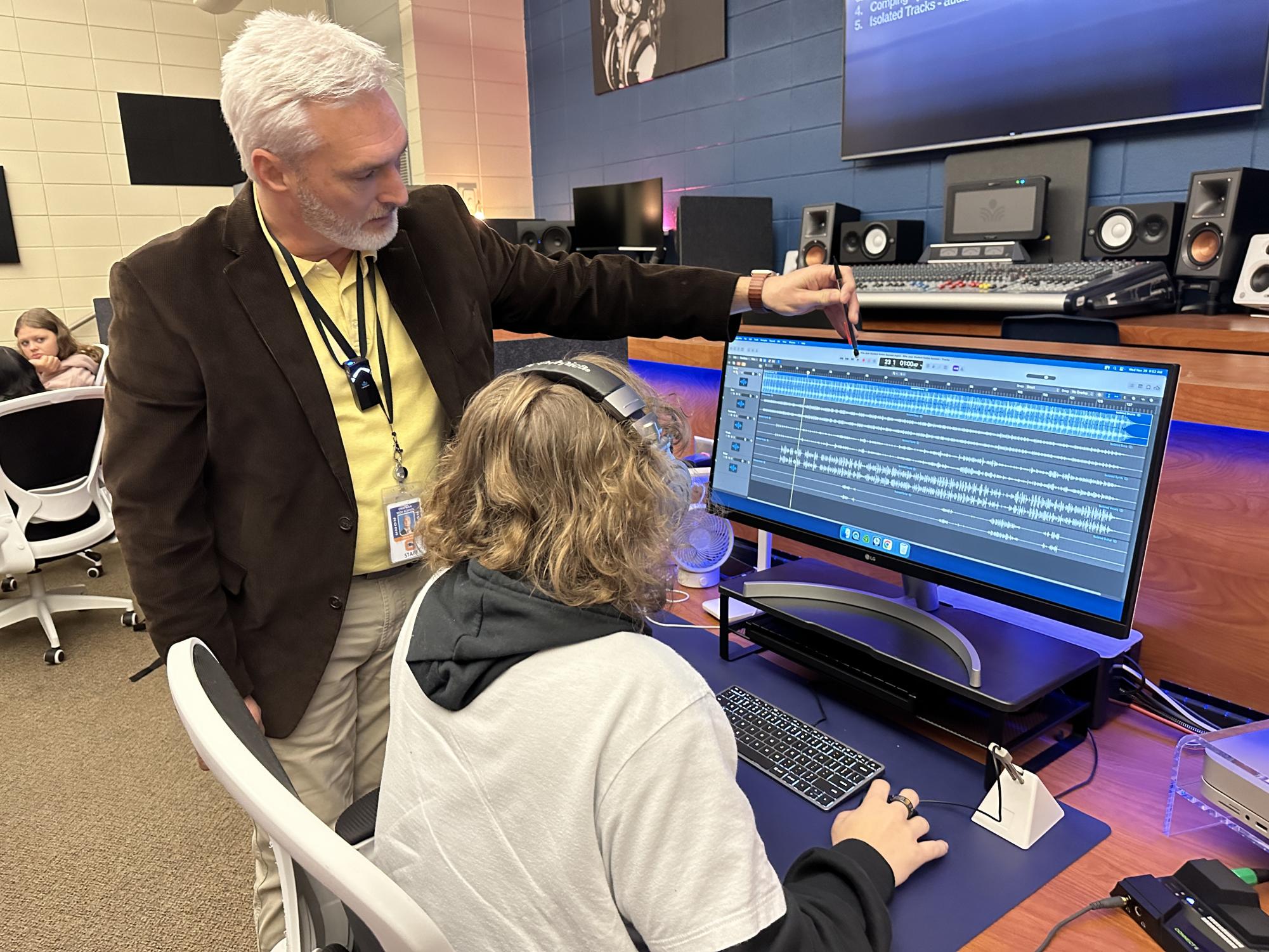 Audio engineering teacher Jimmy Pryor works with junior Deven Hawkins to use artificial intelligence to extract instruments from popular songs. Chapman teachers and students are learning when and how to use AI effectively and ethically.
