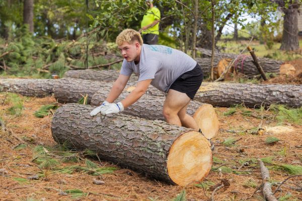 Senior Caden Stockman helps move debris following Hurriance Helen. Stockman worked with his church, Lake Bowen Baptist Church, to help clean up following the storm. 