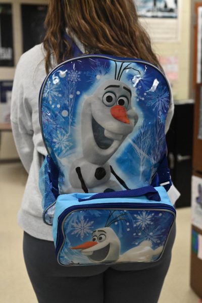 Seniors carry the backpacks of their childhoods